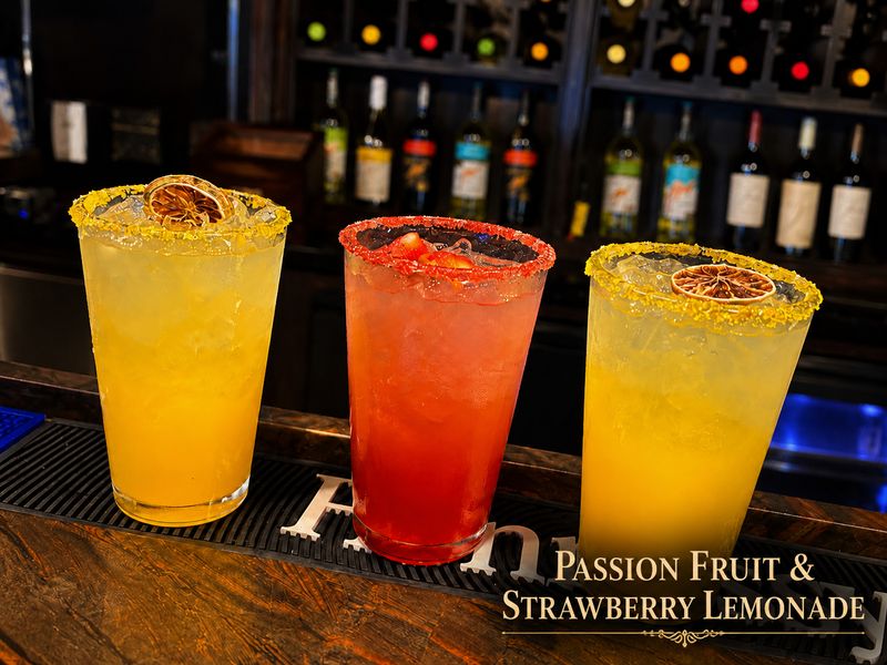 Passion fruit and strawberry lemonades with sugar rims