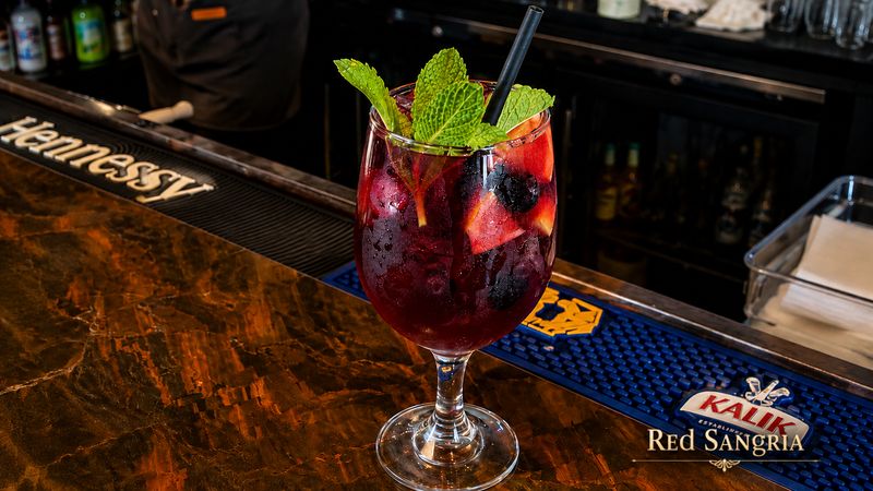 Red sangria with fresh mint and berries at the bar